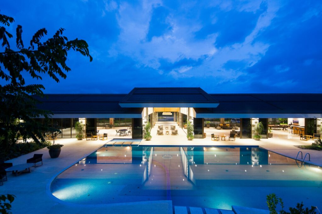 an open building with huge pool during night time